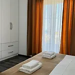 August Ксамил